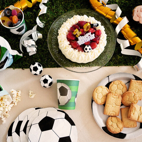 Cake decoration, soccer shoes and a ball