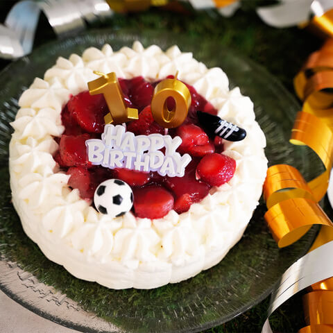 Cake decoration, soccer shoes and a ball